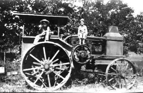 Tractor for pulling a threshing machine